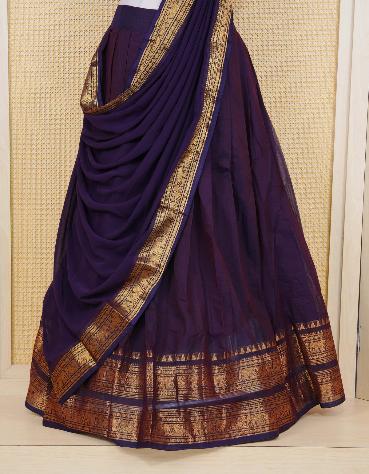 Deep Purple colour Chettinad Semi Stitched dhavani set Featuring contrast self colour with Gold zari border on skirt, Contrast Blouse piece & matching dupatta.