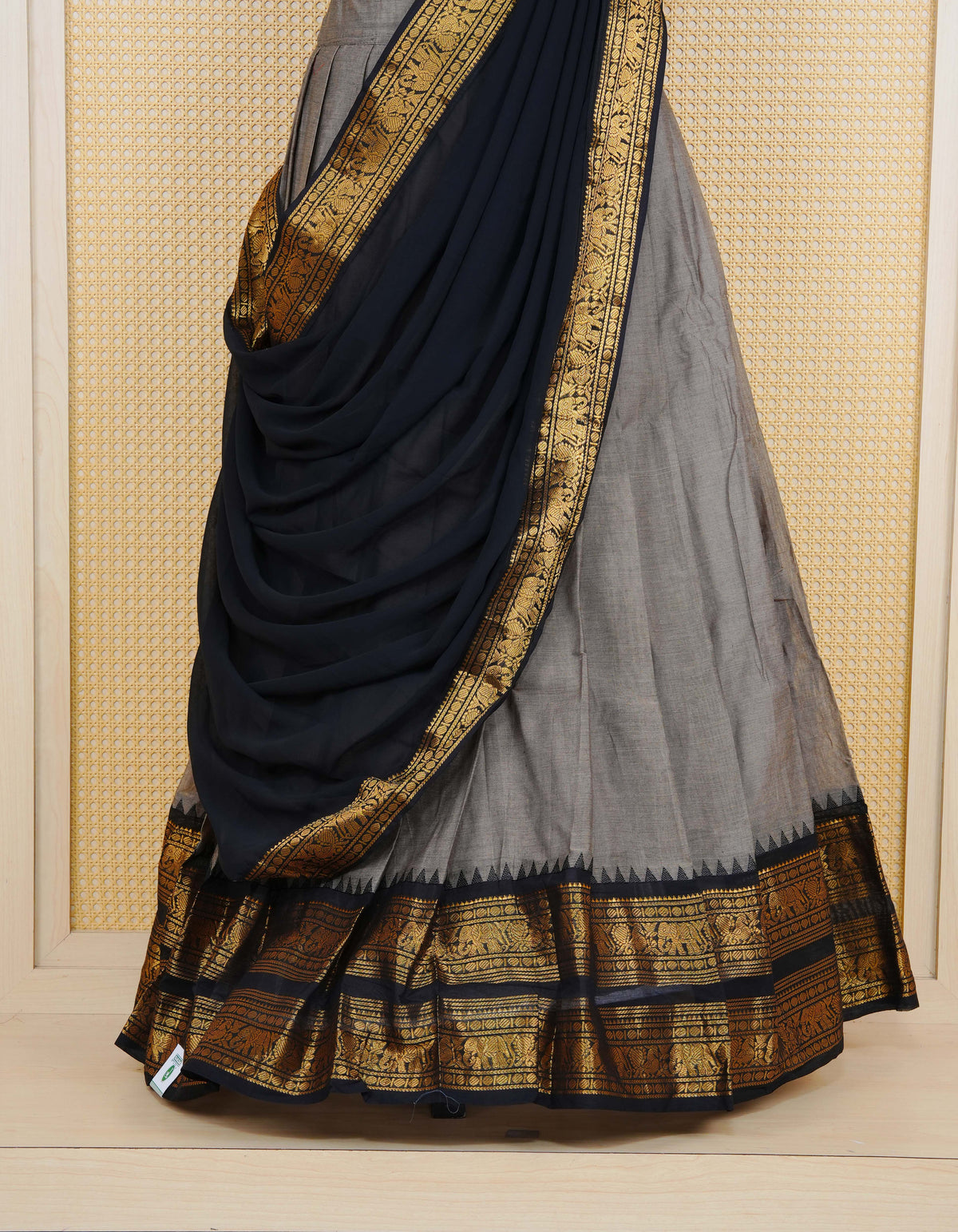 Grey colour Chettinad Semi Stitched dhavani set Featuring contrast Black with Gold zari border on skirt, Contrast Blouse piece & matching dupatta.