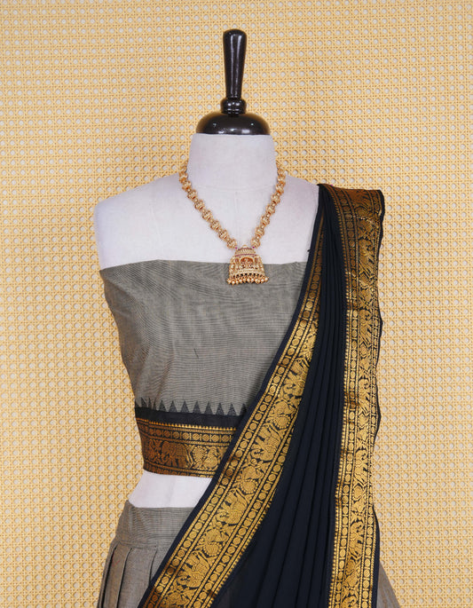 Grey colour Chettinad Semi Stitched dhavani set Featuring contrast Black with Gold zari border on skirt, Contrast Blouse piece & matching dupatta.