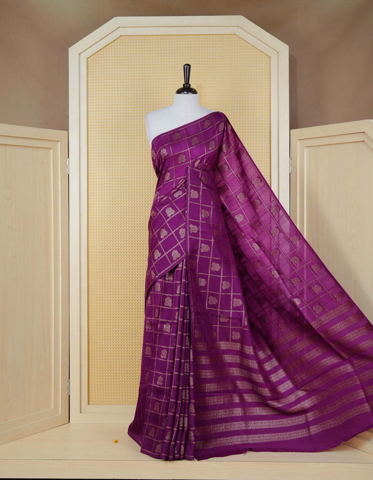 Purple colour semi banaras tussar georgette saree featuring gold zari check with motifs on body, no specific border and paired with matching blouse piece.