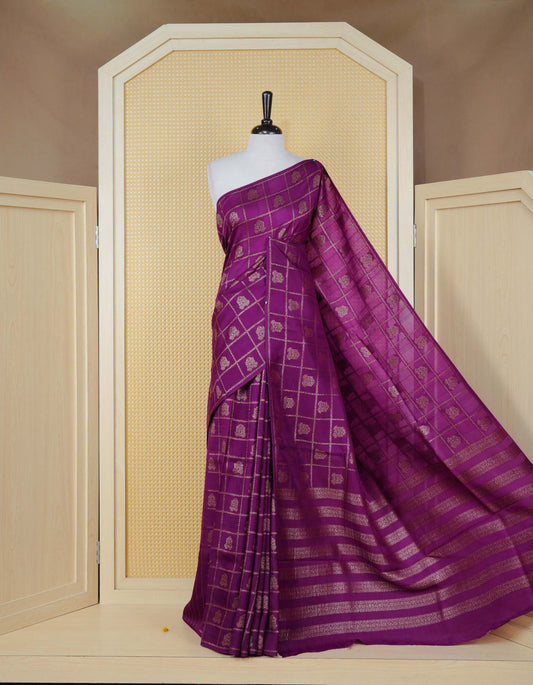 Purple colour semi banaras tussar georgette saree featuring gold zari check with motifs on body, no specific border and paired with matching blouse piece.