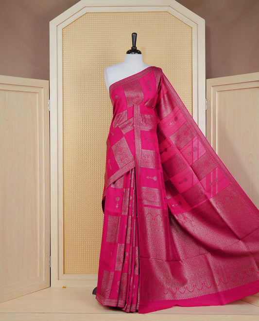 Pink colour semi banaras tussar georgette saree featuring gold zari box pattern with motifs on body, finished with gold zari fancy border and paired with matching blouse piece.