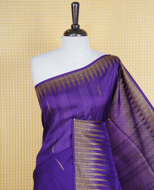 Rich purple colour semi banaras tussar georgette saree featuring gold zari pattern on body, finished with gold zari temple border and paired with matching blouse piece.