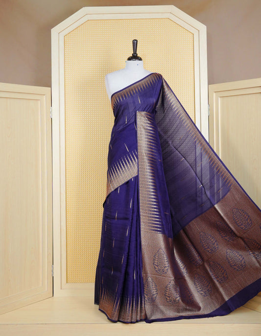 Dark blue colour semi banaras tussar georgette saree featuring gold zari pattern on body, finished with gold zari temple border and paired with matching blouse piece.