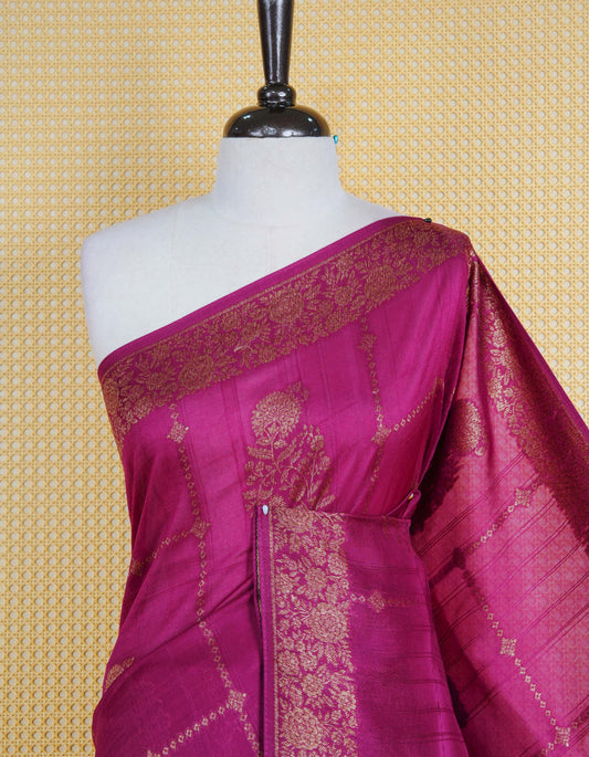 Purple colour semi banaras tussar georgette saree featuring gold zari floral pattern on body, finished with gold zari floral motifs on border and paired with matching blouse piece.