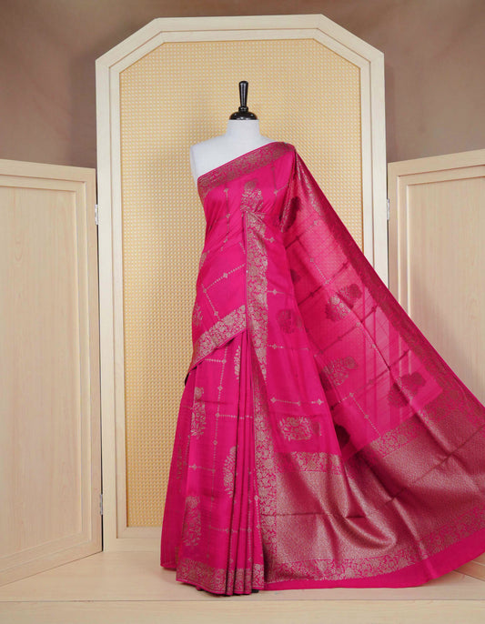 Pink colour semi banaras tussar georgette saree featuring gold zari floral pattern on body, finished with gold zari floral motifs on border and paired with matching blouse piece.
