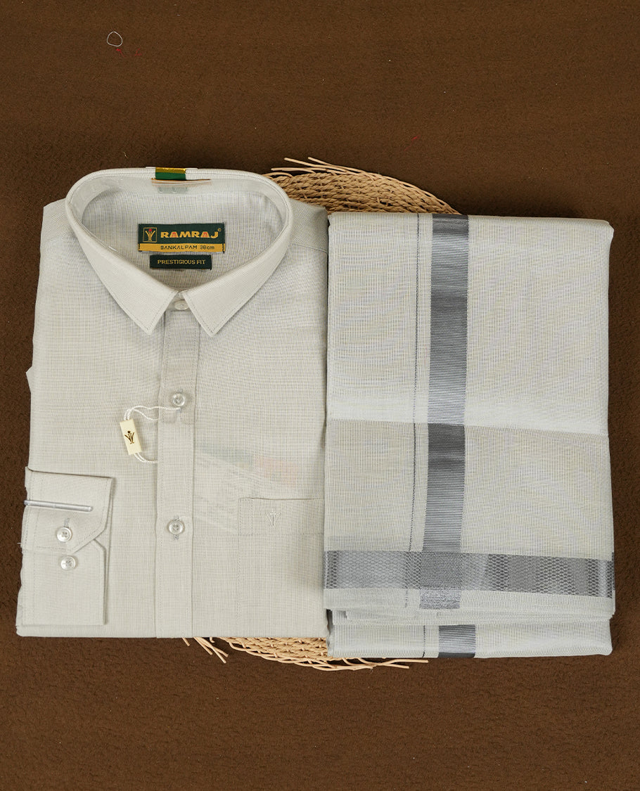 Blue Silver Colour shirt by RAMRAJ paired with a matching dhoti, all elegantly finished with a Blue silver border.