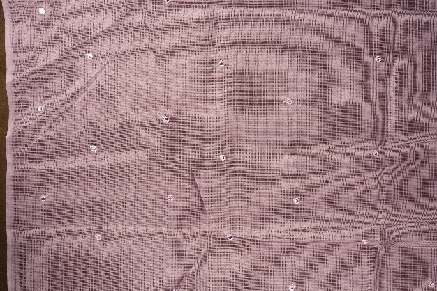 Lavender colour Doriya check cotton saree with soft sequins work on the body, elegant embroidery scallop border, and a simple pallu & Comes with a matching plain blouse piece.