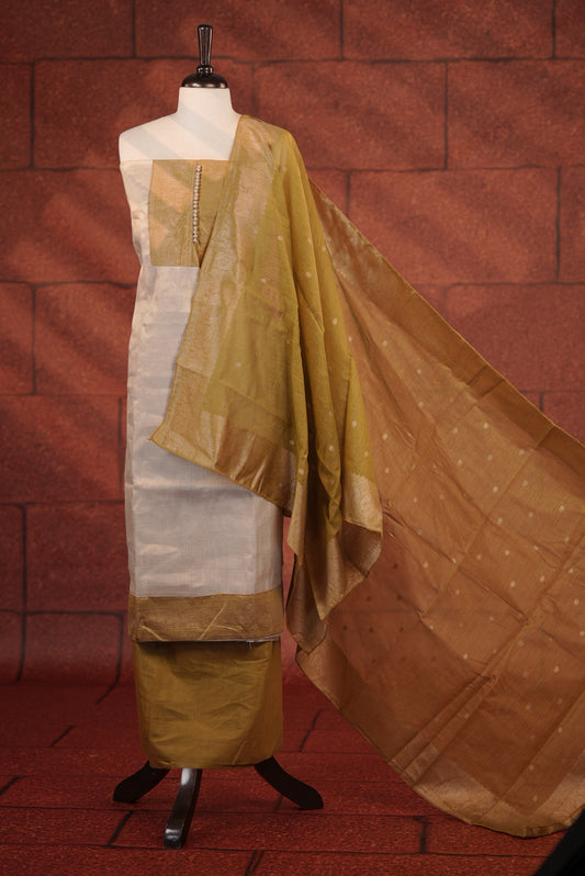 Olive Green Colour Soft Tissue Salwar Material Featuring Elegant Beige Work On The Neck, Complemented By A Contrast Bottom And A Semi Banarasi Dupatta.