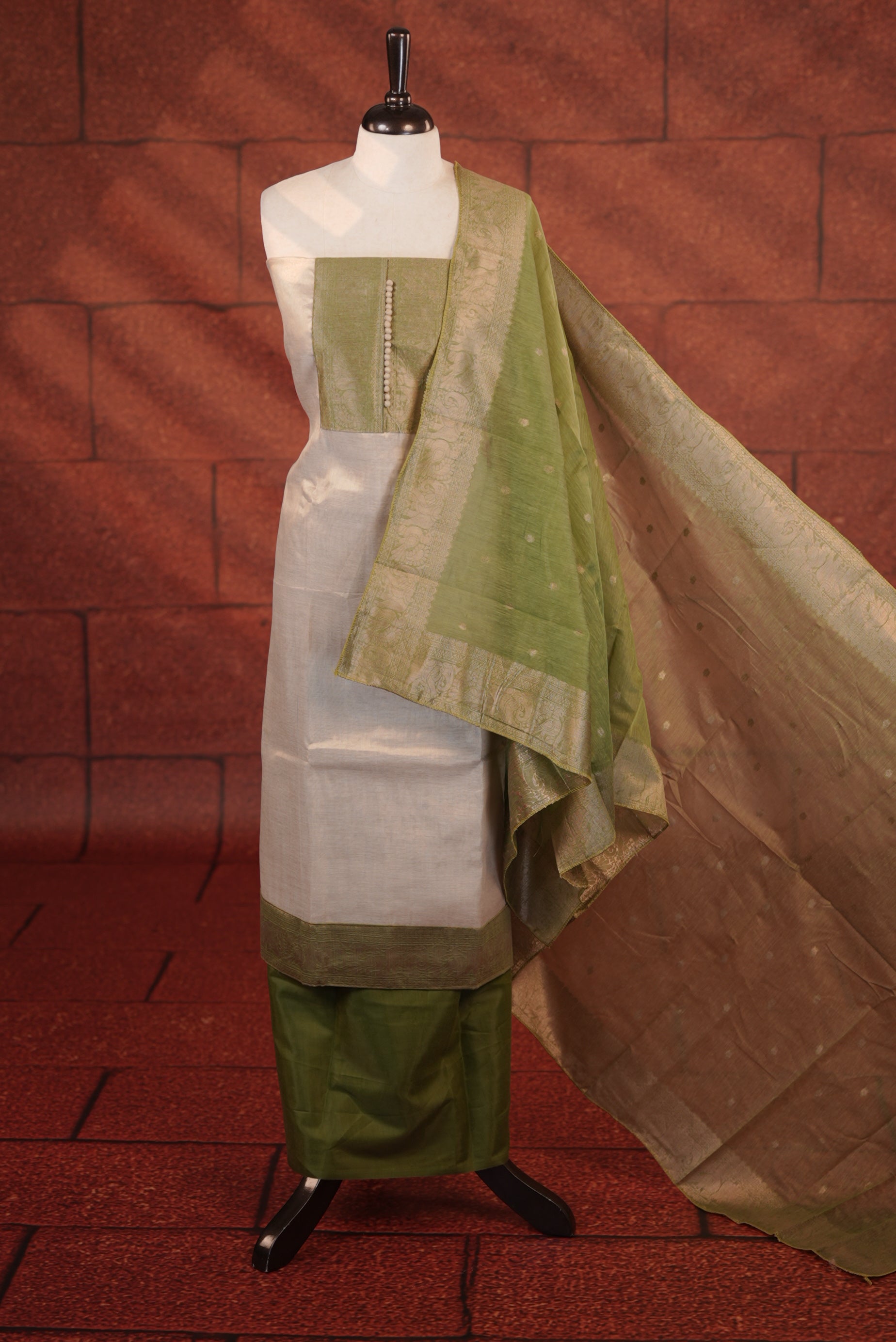 Light Green Colour Soft Tissue Salwar Material Featuring Elegant Beige Work On The Neck, Complemented By A Contrast Bottom And A Semi Banarasi Dupatta.