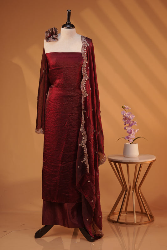 Maroon colour Fendy silk salwar material With Elegant plain body with lining, Comes with santoon bottom, Fendy silk dupatta With Floral buttas & Scalp Border.