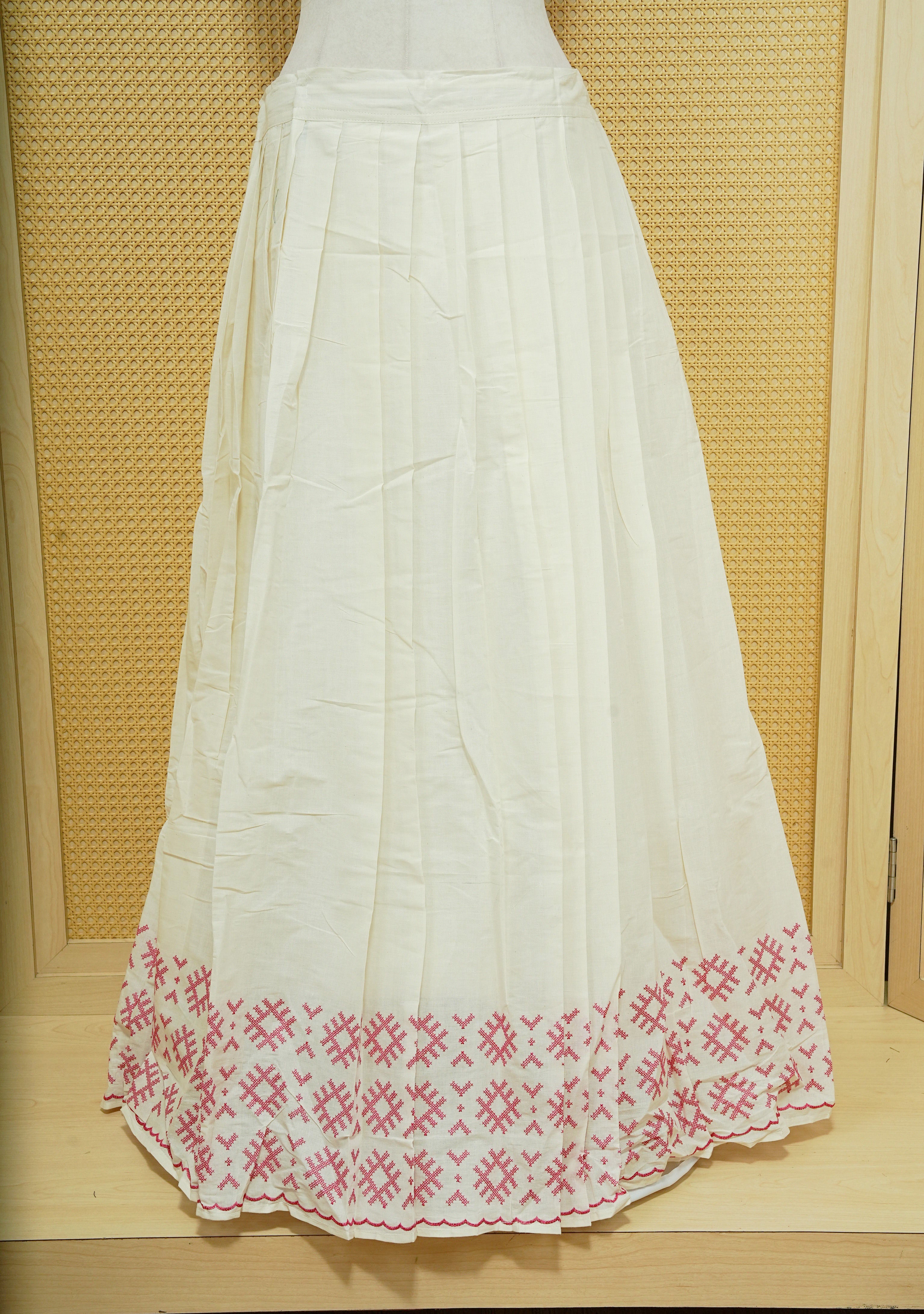 Cream colour cotton Stitched Skirt With Pink colour thread pattern Scallop border.