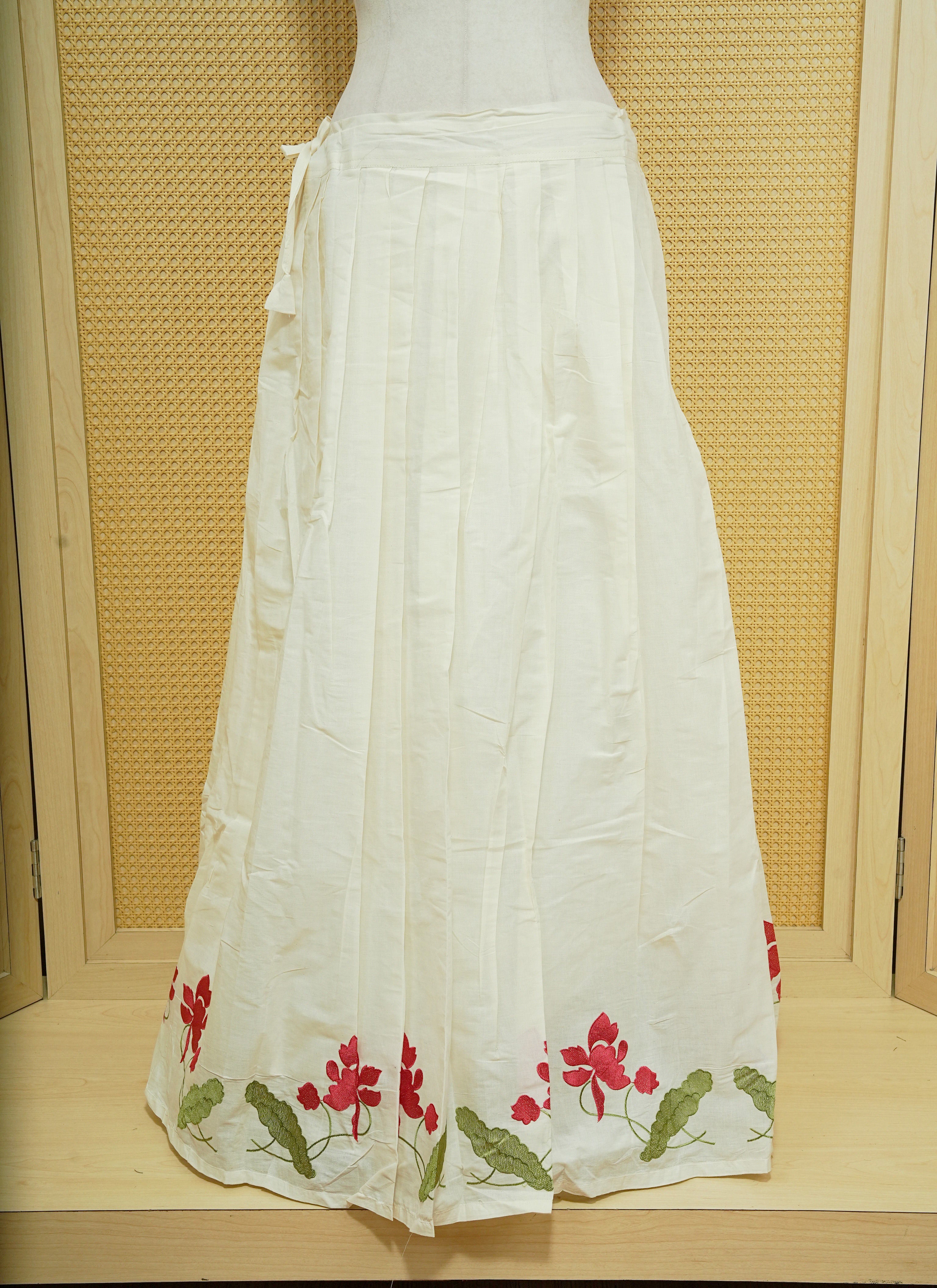 Cream colour cotton Stitched Skirt With Red colour floral & Leaf kodi thread pattern border.