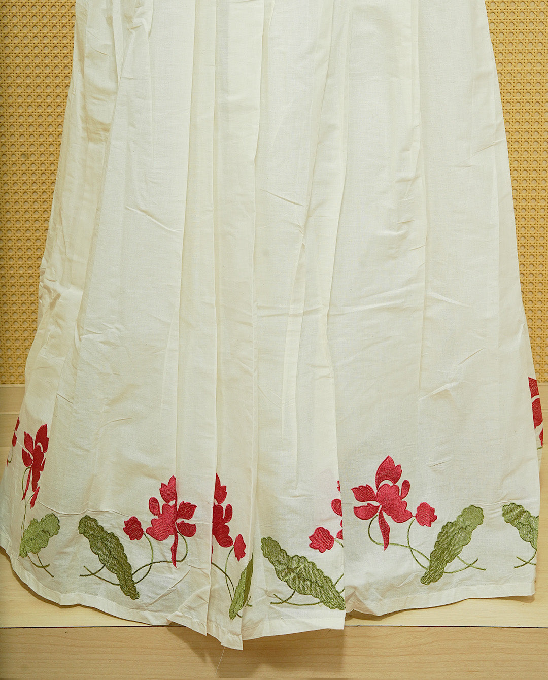 Cream colour cotton Stitched Skirt With Red colour floral & Leaf kodi thread pattern border.