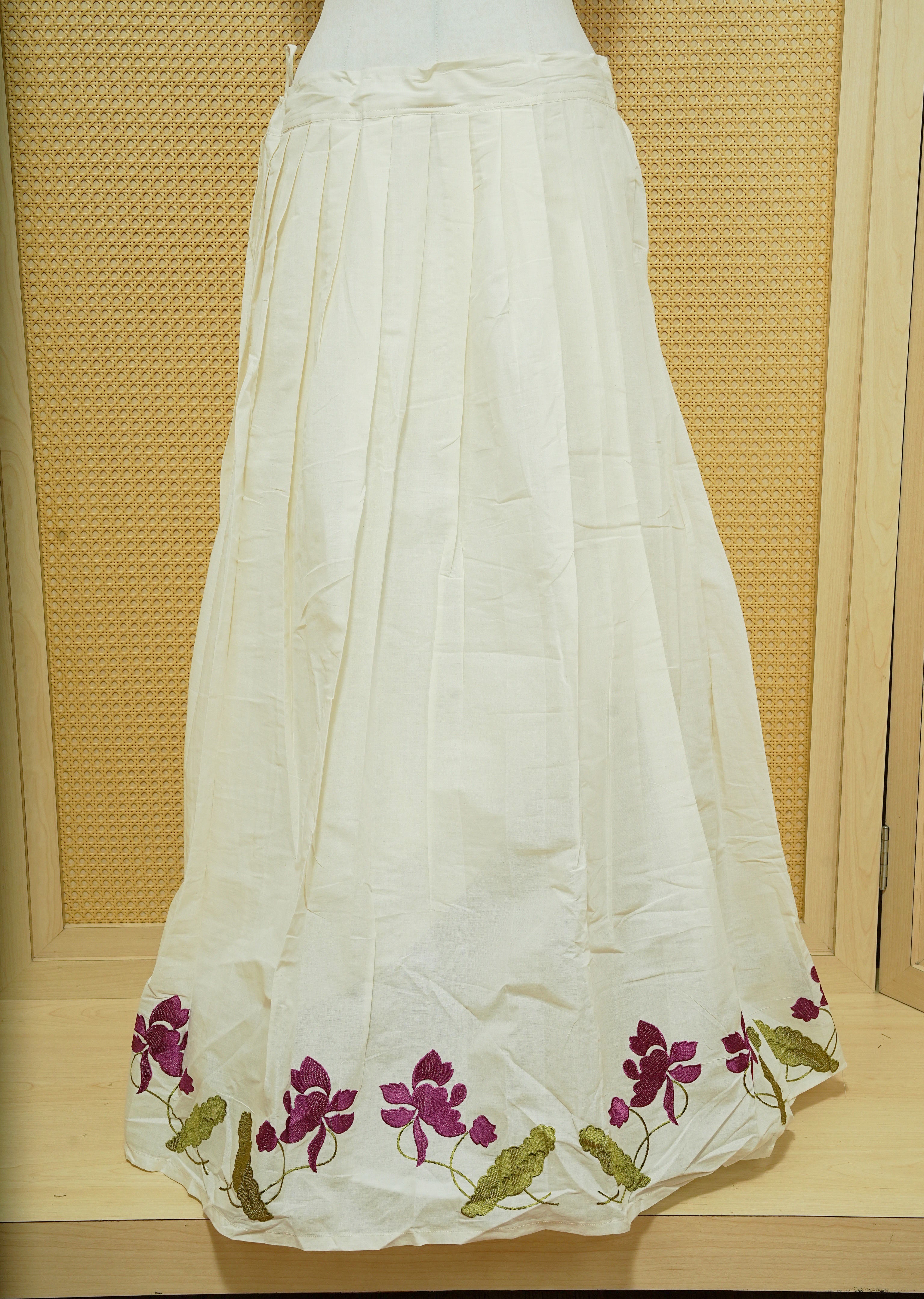 Cream colour cotton Stitched Skirt With Purple colour floral & Leaf kodi thread pattern border.