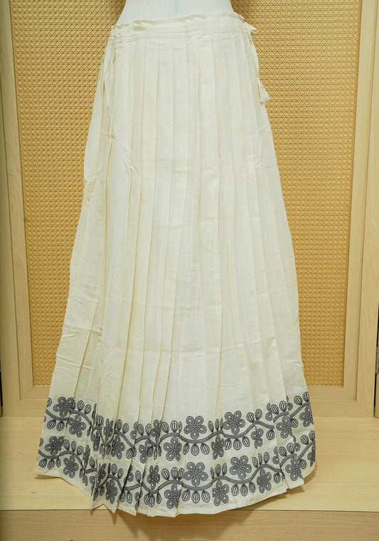 Cream colour cotton Stitched Skirt With Blue colour Floral thread pattern on the border.