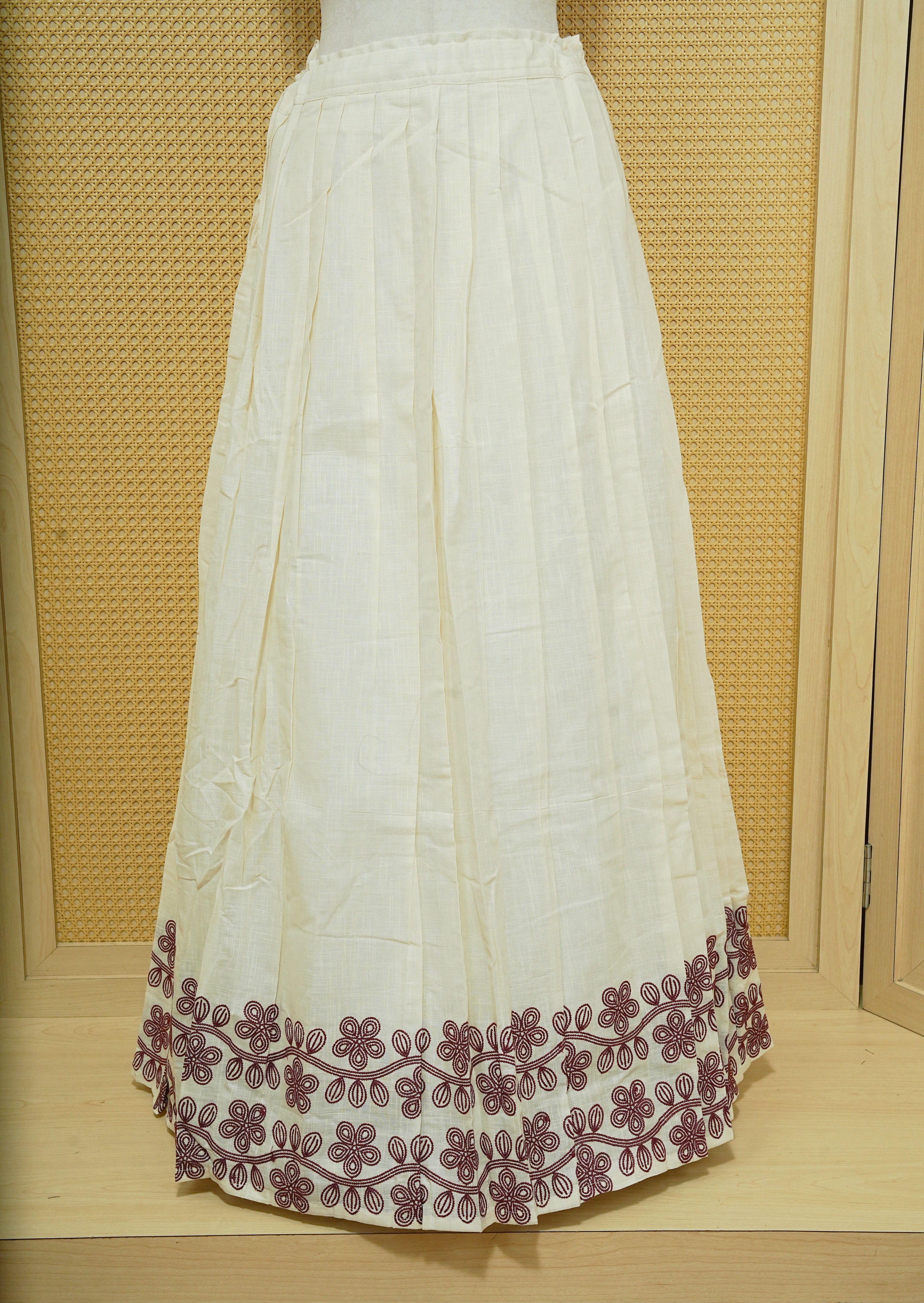 Cream colour cotton Stitched Skirt With Maroon colour Floral thread pattern on the border.
