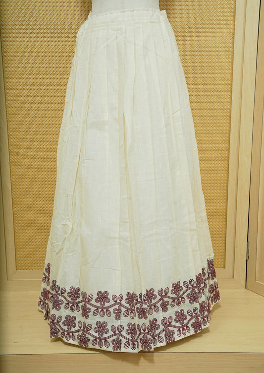 Cream colour cotton Stitched Skirt With Maroon colour Floral thread pattern on the border.