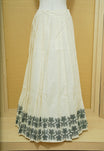 Cream colour cotton Stitched Skirt With Green colour Floral thread pattern on the border.