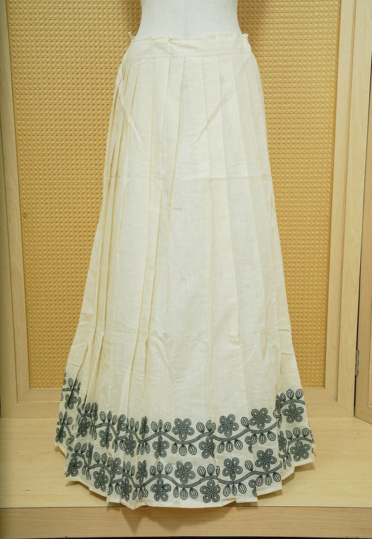 Cream colour cotton Stitched Skirt With Green colour Floral thread pattern on the border.