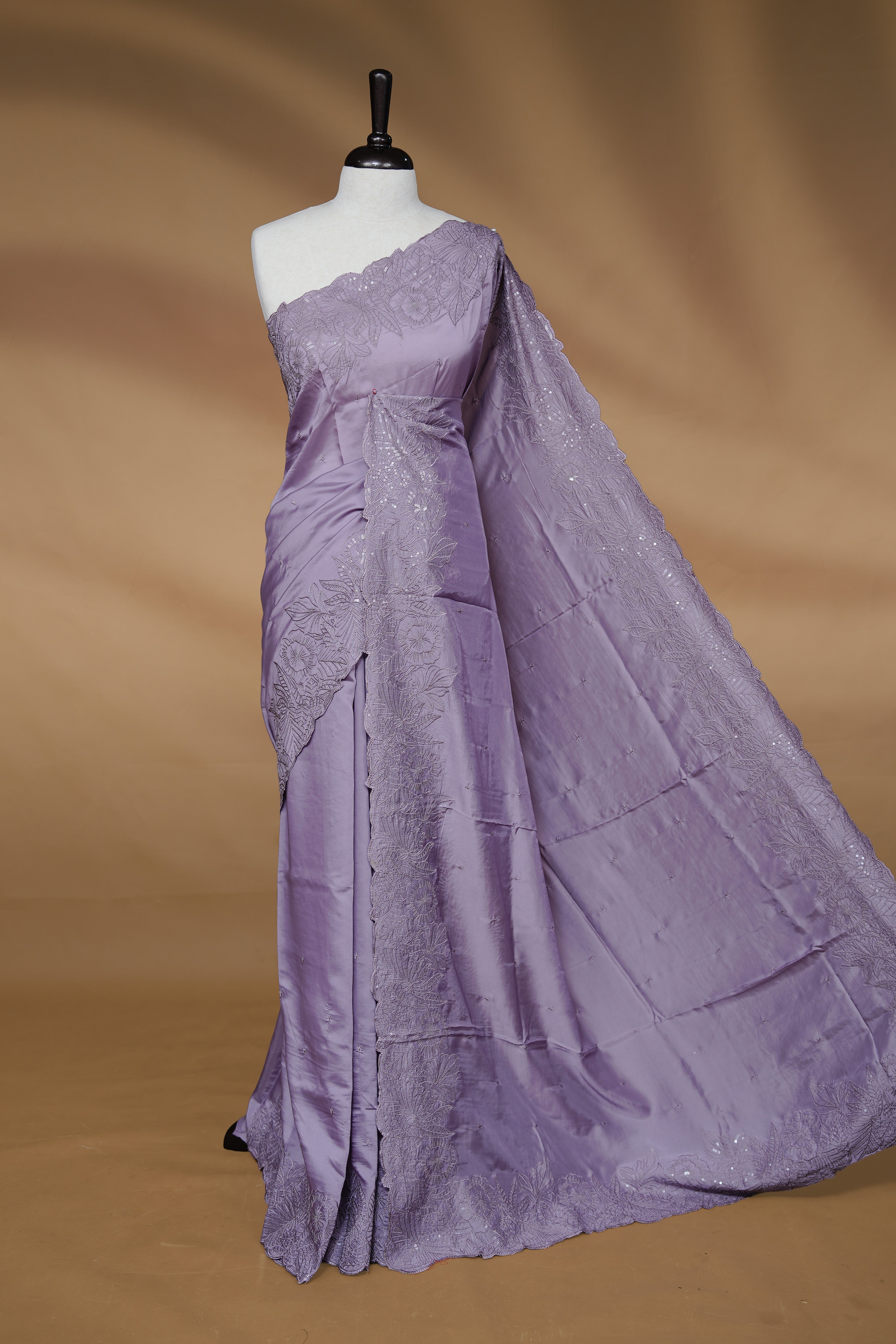 Pastel Lavender colour Designer saree featuring Elegant Thread & sequins body, complemented self colour thread & Sequins scalp border, paired with matching blouse piece.