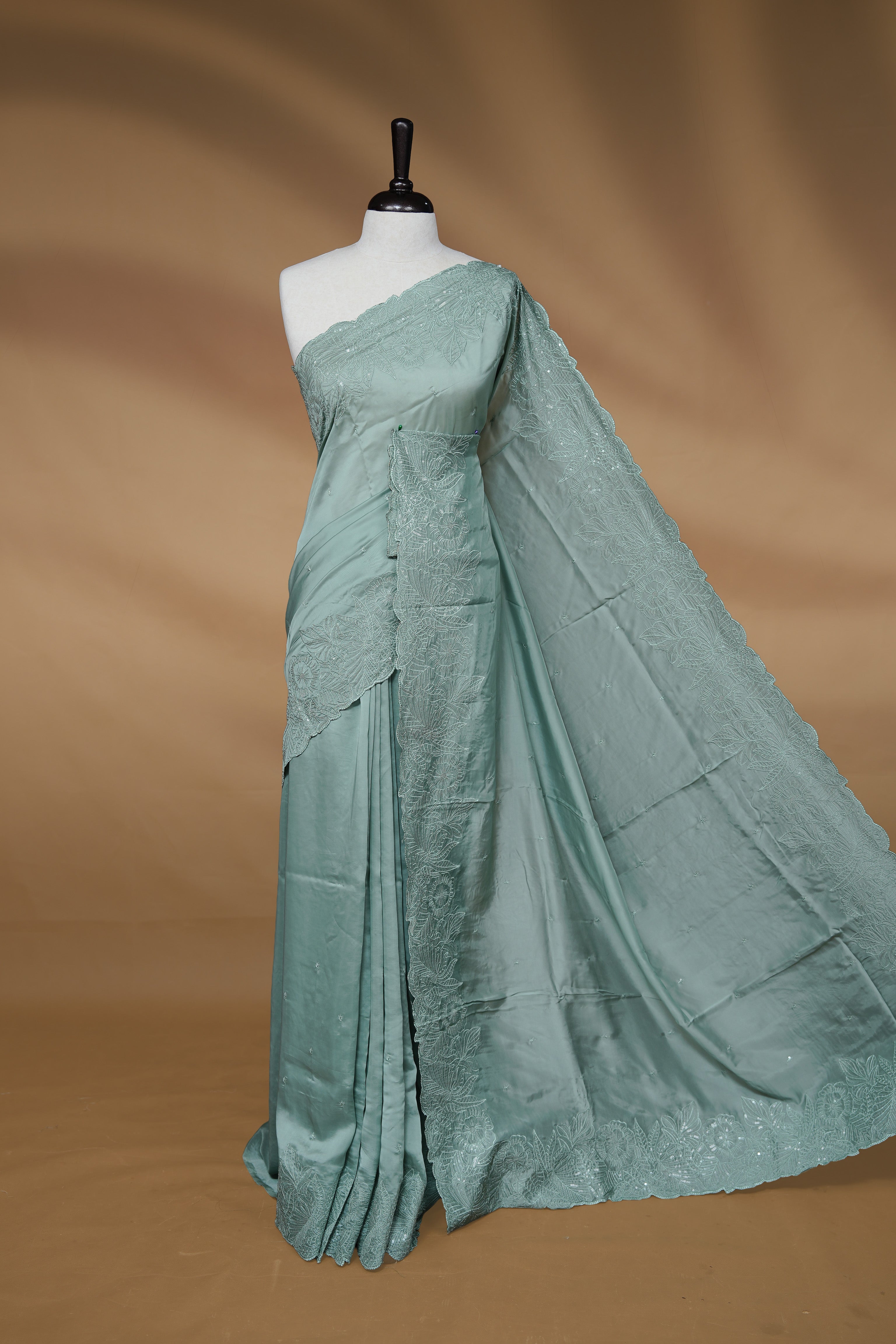 Pastel Green colour Designer saree featuring Elegant Thread & sequins  body, complemented self colour thread & Sequins scalp border, paired with matching blouse piece.