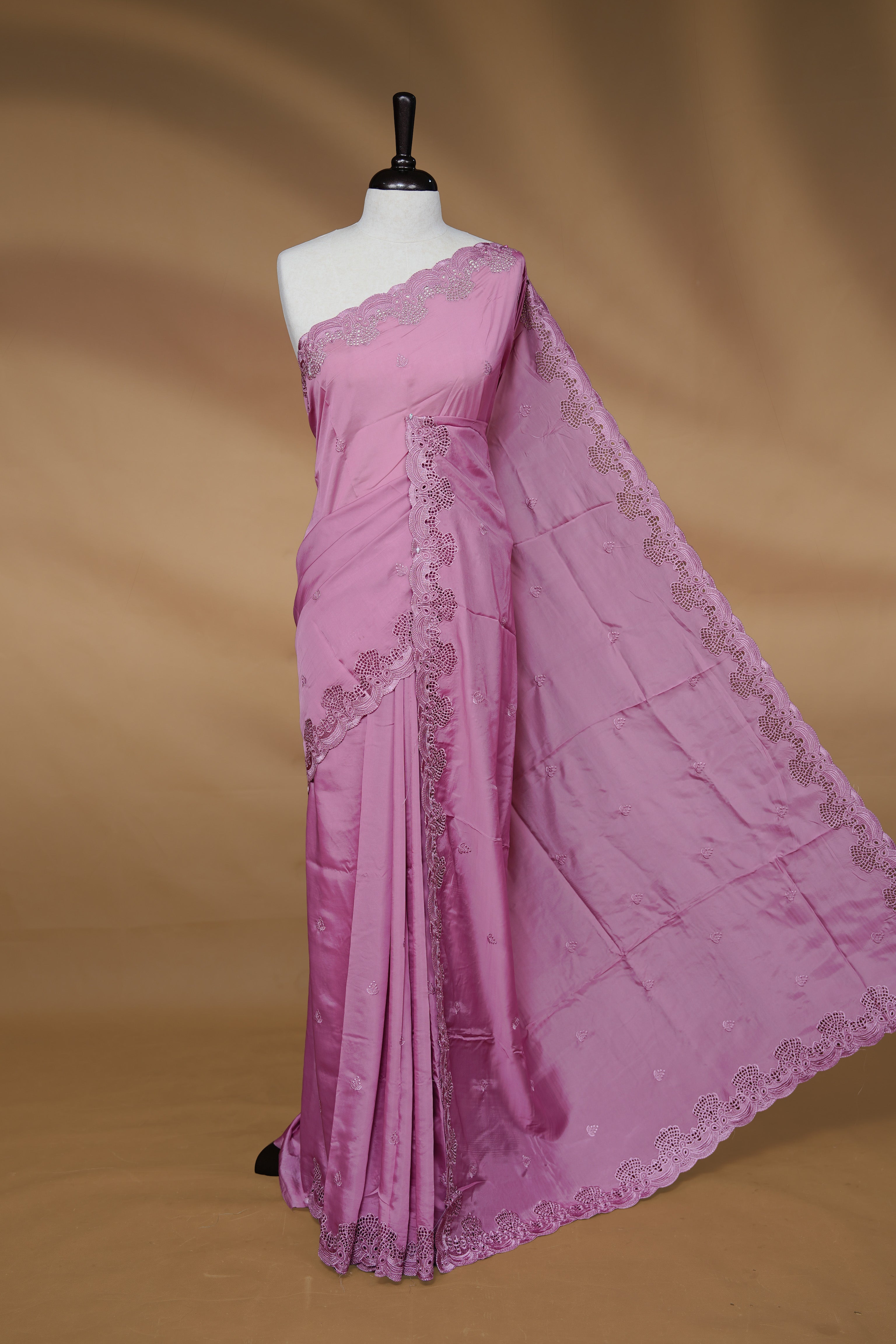 Pastel Pink colour Designer saree featuring Classic Plain body Styled with Thread motifs, Enrich with Thread & scalp border, paired with matching blouse piece.