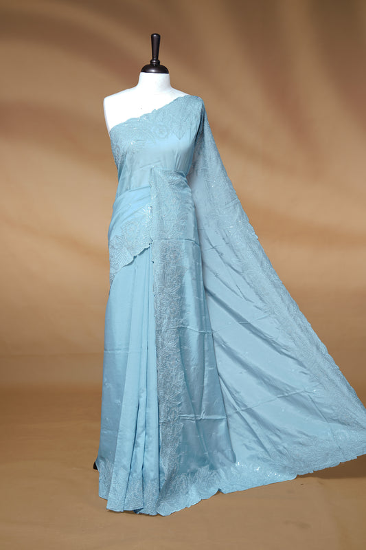 Pastel Blue colour Designer saree featuring Elegant Thread & Sequins body, complemented self colour thread & Sequins scalp border, paired with matching blouse piece.
