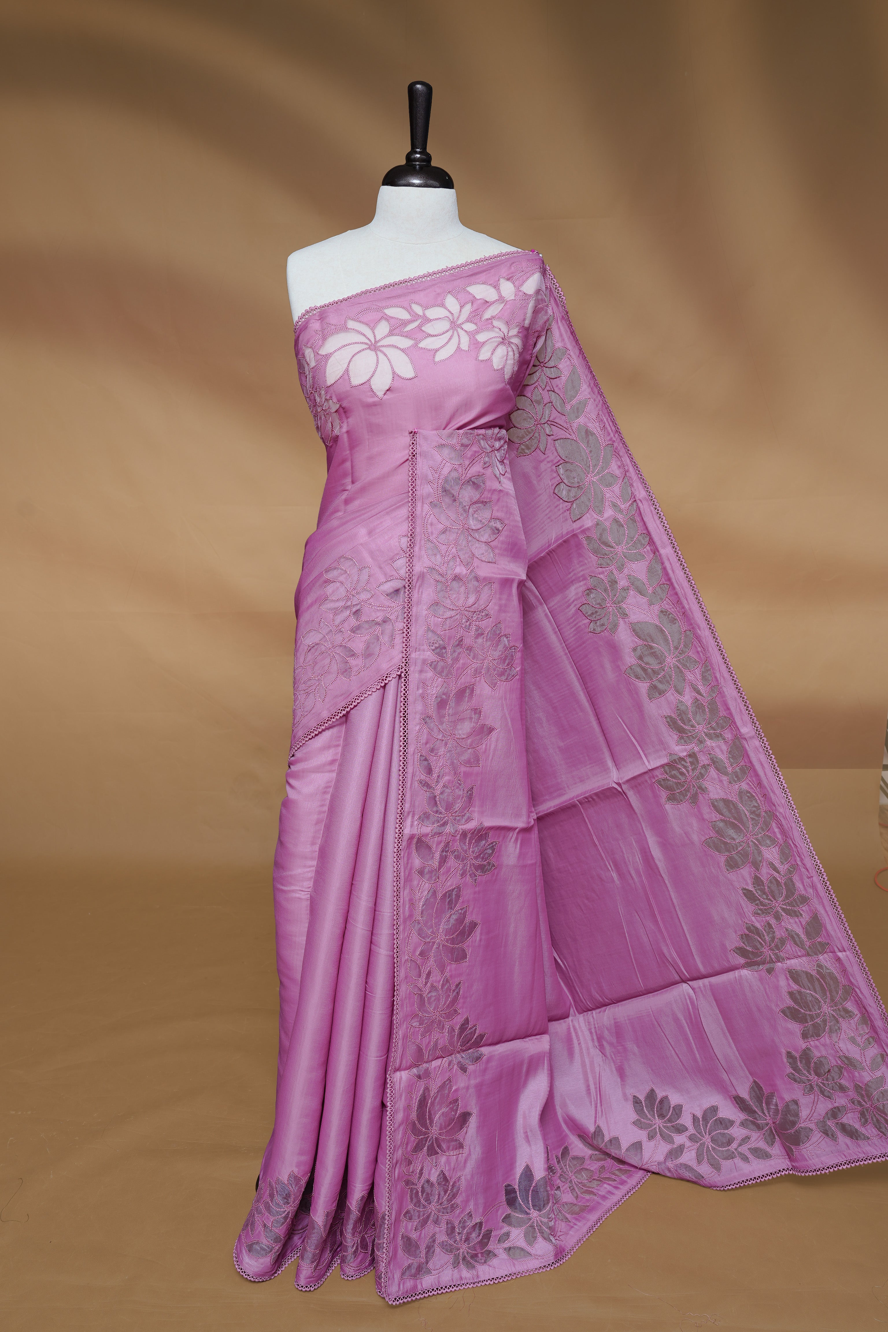 Pastel Pink colour Designer saree Featuring Elegant plain body, enhance with thread Lotus Pattern with lace border, paired with matching blouse piece.