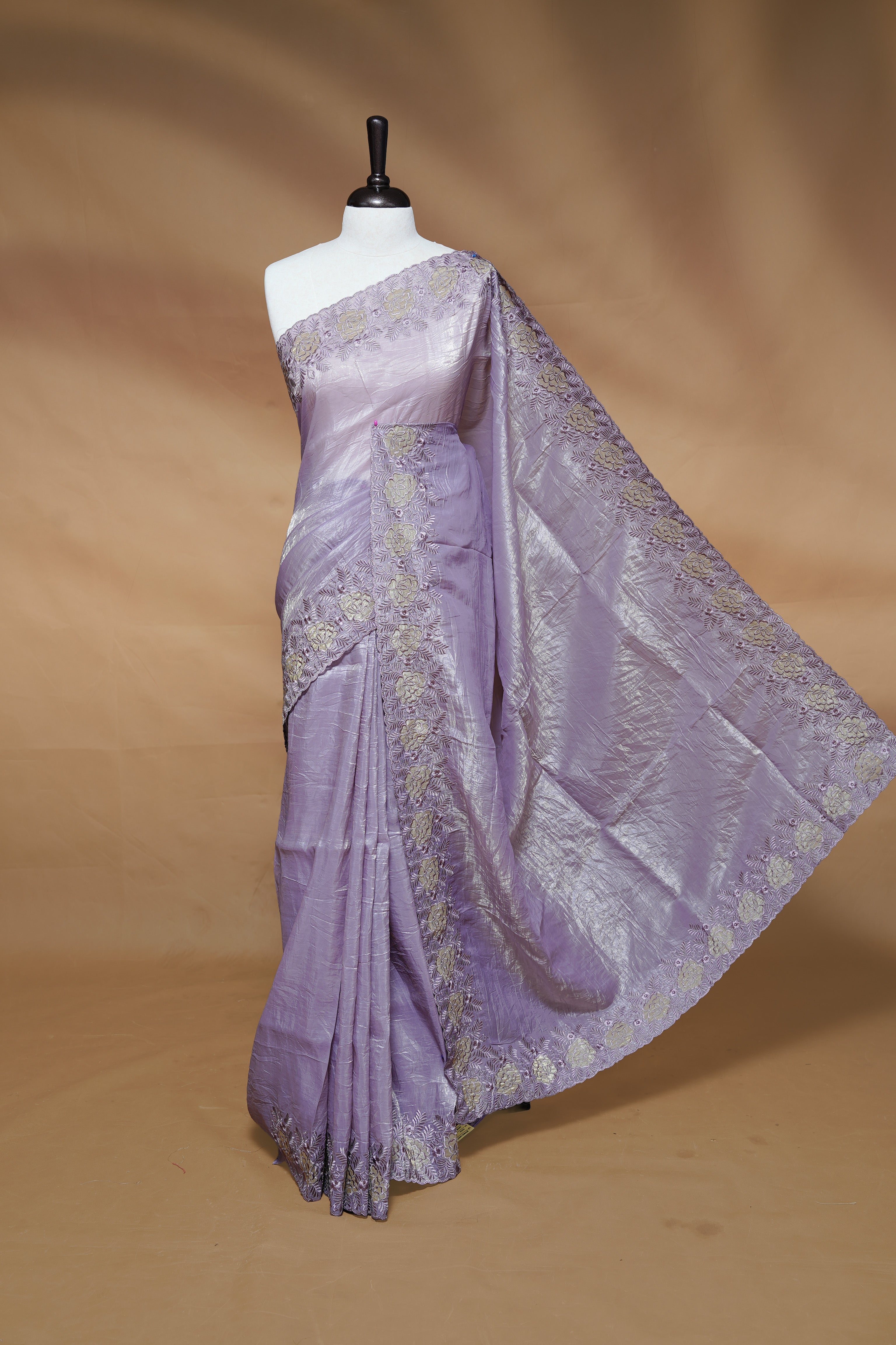 Pastel purple colour Crush Organza Featuring Plain body, Enrich with Floral thread pattern & scalp border, paired with matching blouse piece.