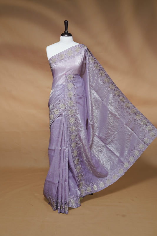 Pastel purple colour Crush Organza Featuring Plain body, Enrich with Floral thread pattern & scalp border, paired with matching blouse piece.