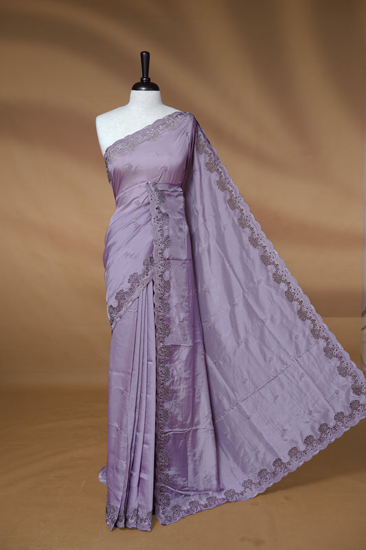 Pastel lavender colour Designer saree featuring Classic Plain body Styled with Thread motifs, Enrich with Thread & scalp border, paired with matching blouse piece.