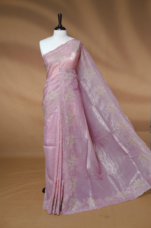 Pastel pink colour Crush Organza Featuring Plain body, Enrich with Floral thread pattern with sequins & scalp border, paired with matching blouse piece.