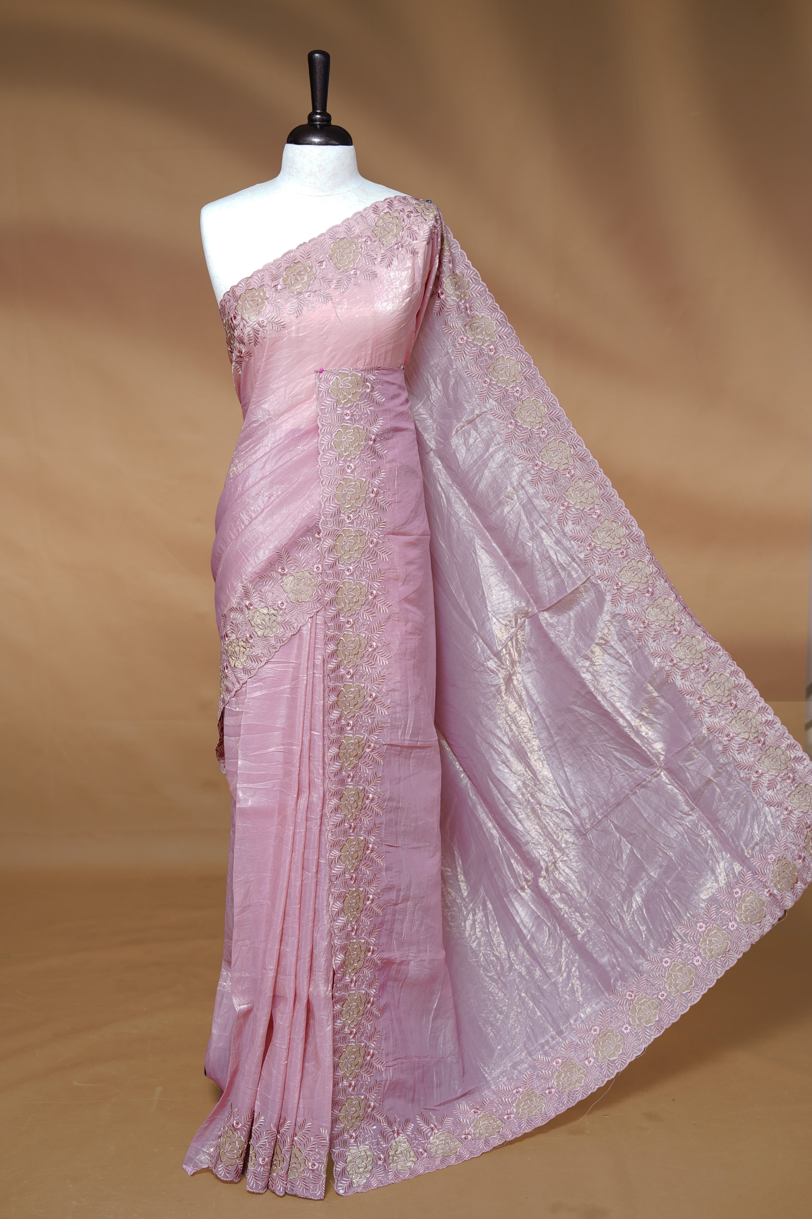 Pastel pink colour Crush Organza Featuring Plain body, Enrich with Floral thread pattern & scalp border, paired with matching blouse piece.
