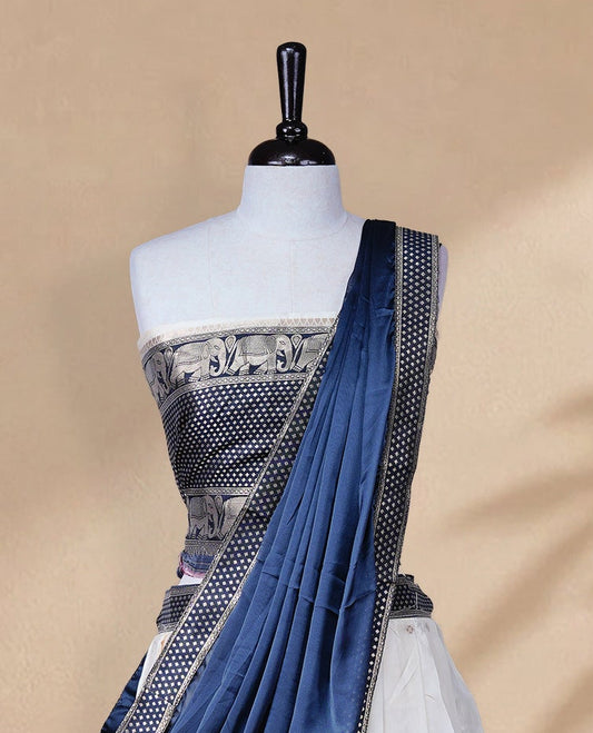 Cream colour Half saree featuring Gold zari buttas on skirt with Zari border on contrast Black colour border, Unstitched Blouse and matching dupatta.