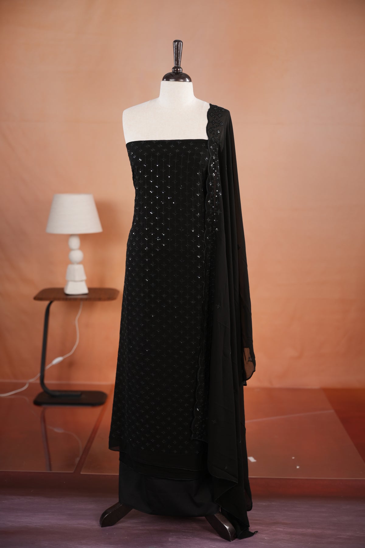 Black colour georgette salwar set  featuring Sequence worked body & border, comes with santoon bottom , paired with same material dupatta with same sequence work.