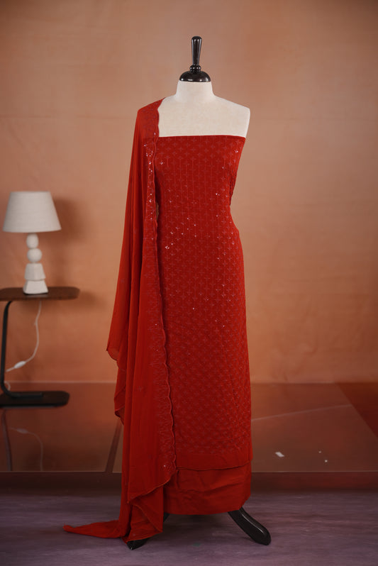 Rust Orange colour georgette salwar set  featuring Sequence worked body & border, comes with santoon bottom , paired with same material dupatta with same sequence work.
