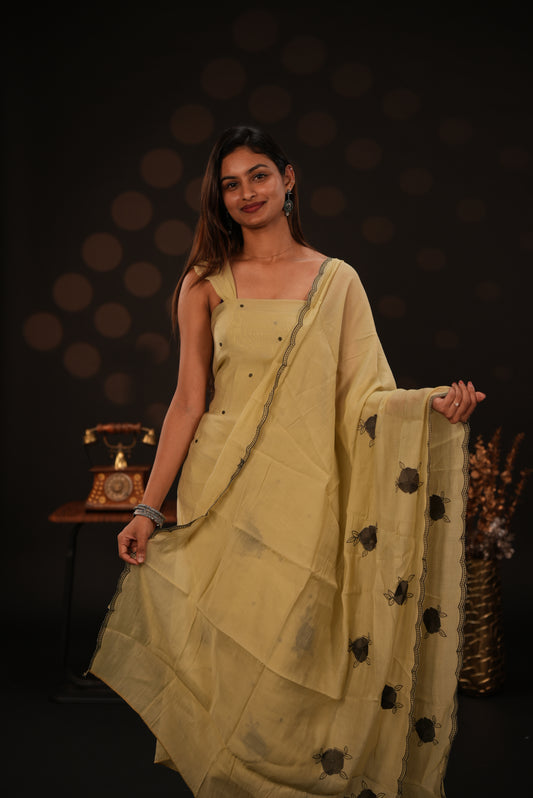Pastel yellow colour mul chanderi salwar material featuring Floral & dot Thread embroidery body and border, paired with Same design with scallop border dupatta and santoon material bottom