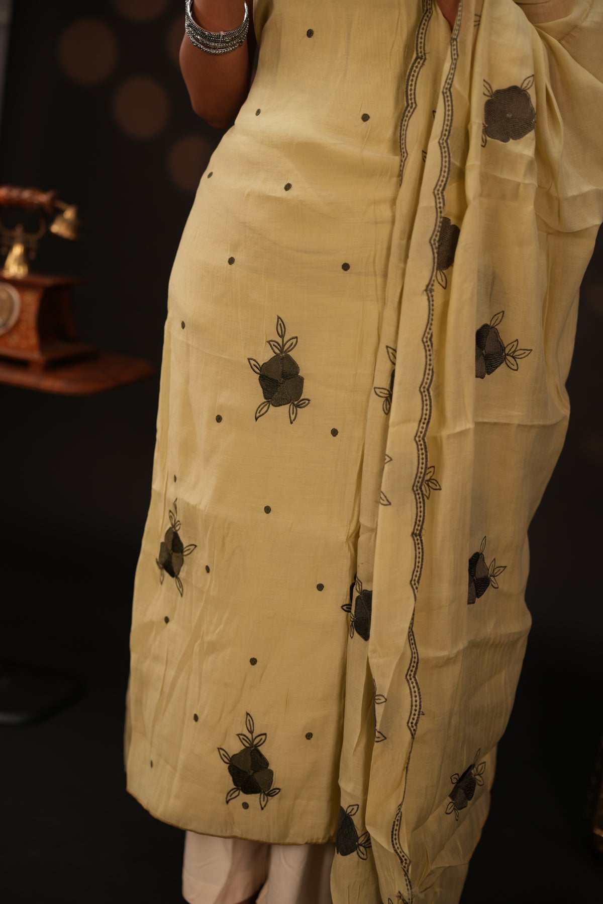 Pastel yellow colour mul chanderi salwar material featuring Floral & dot Thread embroidery body and border, paired with Same design with scallop border dupatta and santoon material bottom