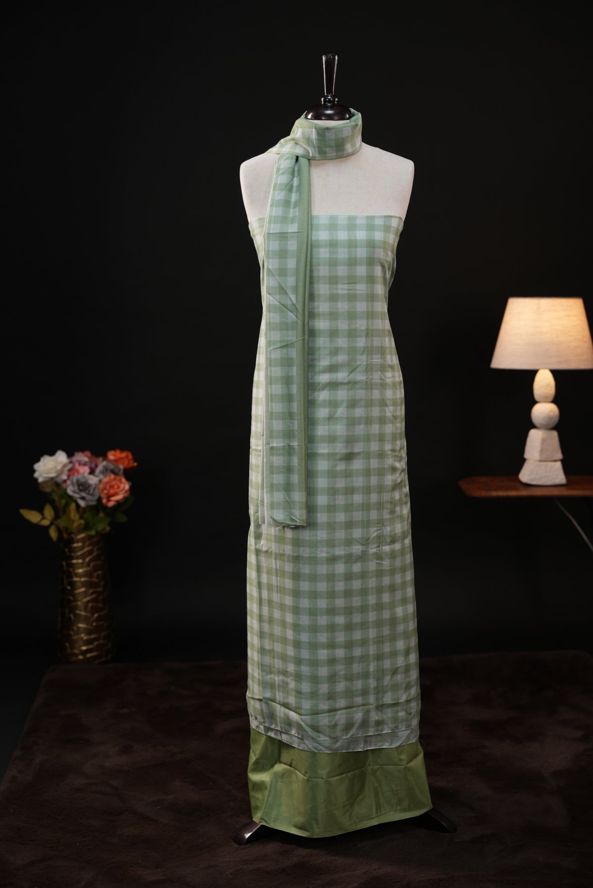 Green colour checked Mul Chanderi salwar material, paired with a matching bottom and dupatta.