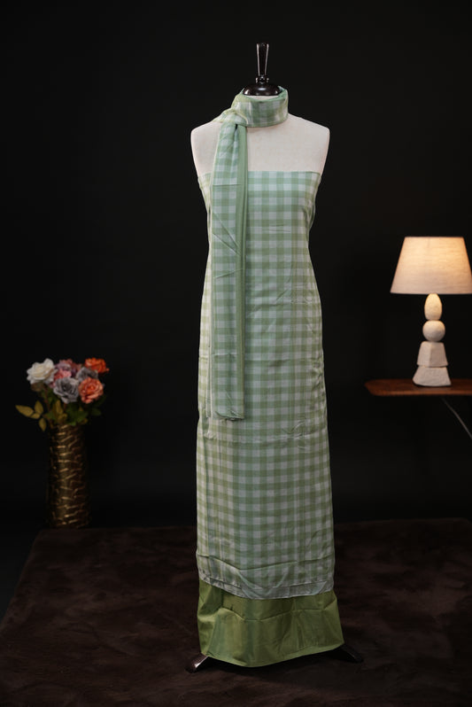 Green colour checked Mul Chanderi salwar material, paired with a matching bottom and dupatta.