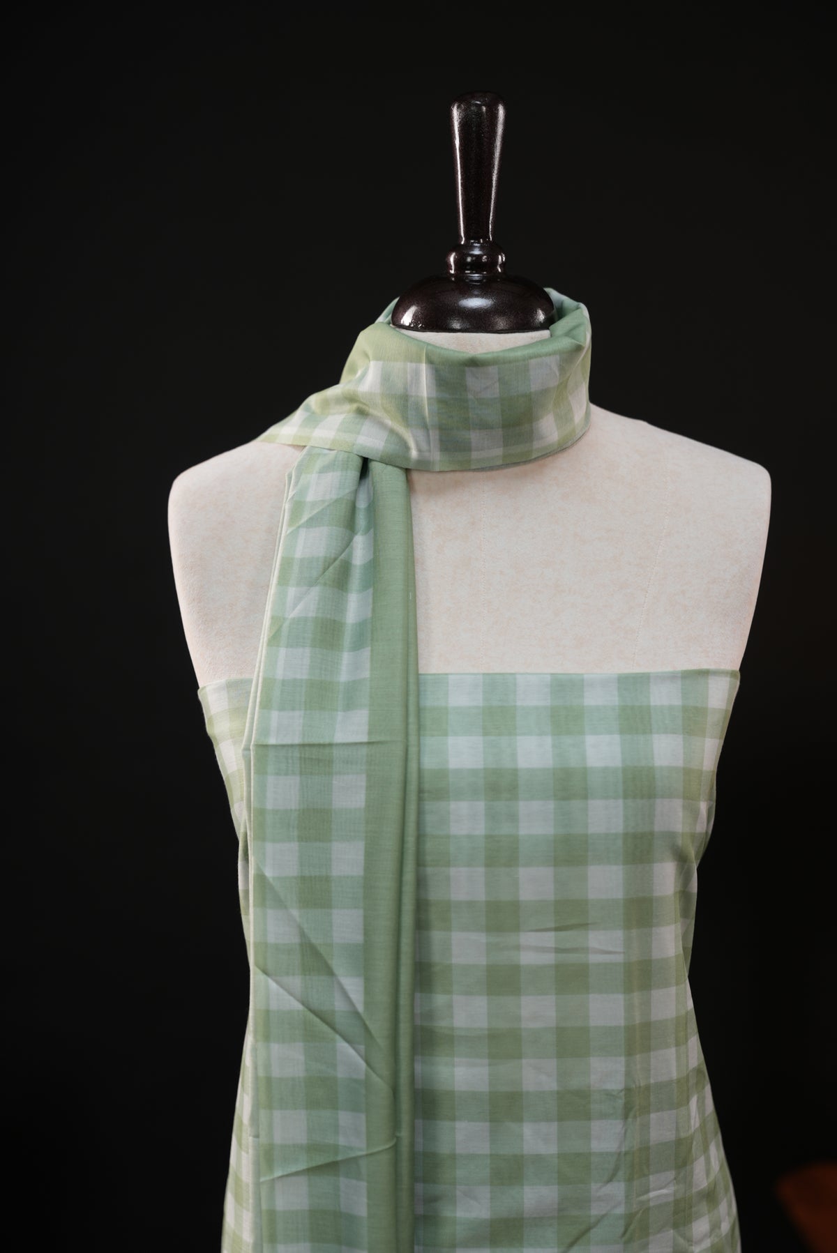 Green colour checked Mul Chanderi salwar material, paired with a matching bottom and dupatta.