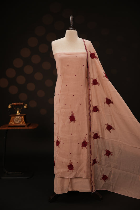 Peach colour mul chanderi salwar material featuring Floral & dot Thread embroidery body and border, paired with Same design with scallop border dupatta and santoon material bottom