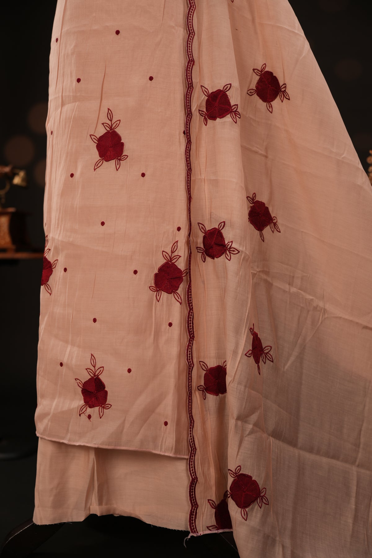 Peach colour mul chanderi salwar material featuring Floral & dot Thread embroidery body and border, paired with Same design with scallop border dupatta and santoon material bottom