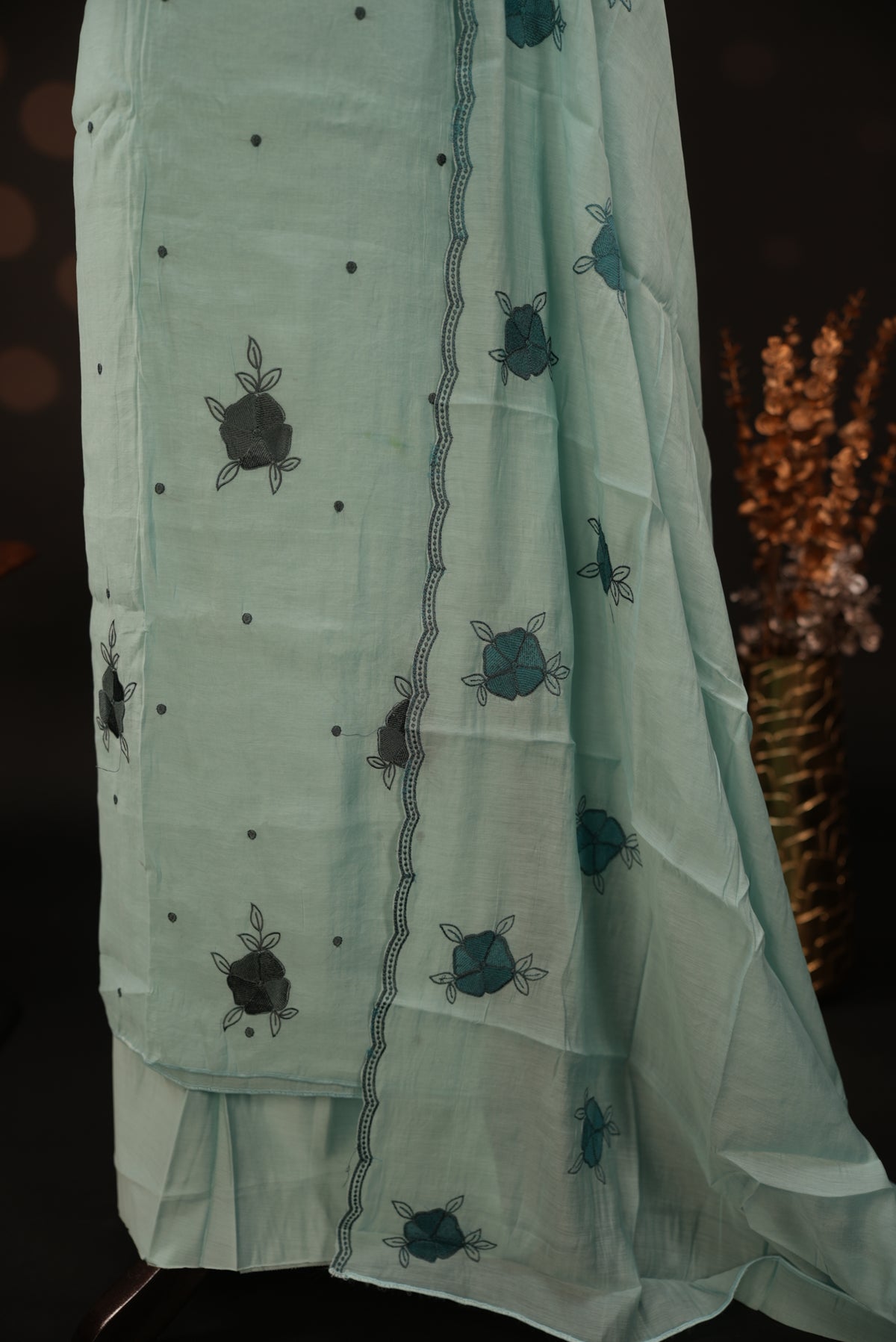 Pastel ice blue colour mul chanderi salwar material featuring Floral & dot Thread embroidery body and border, paired with Same design with scallop border dupatta and santoon material bottom
