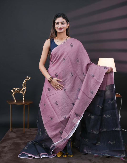 Onion Pink and black half and half semi linen saree having leaf and floral prints on body