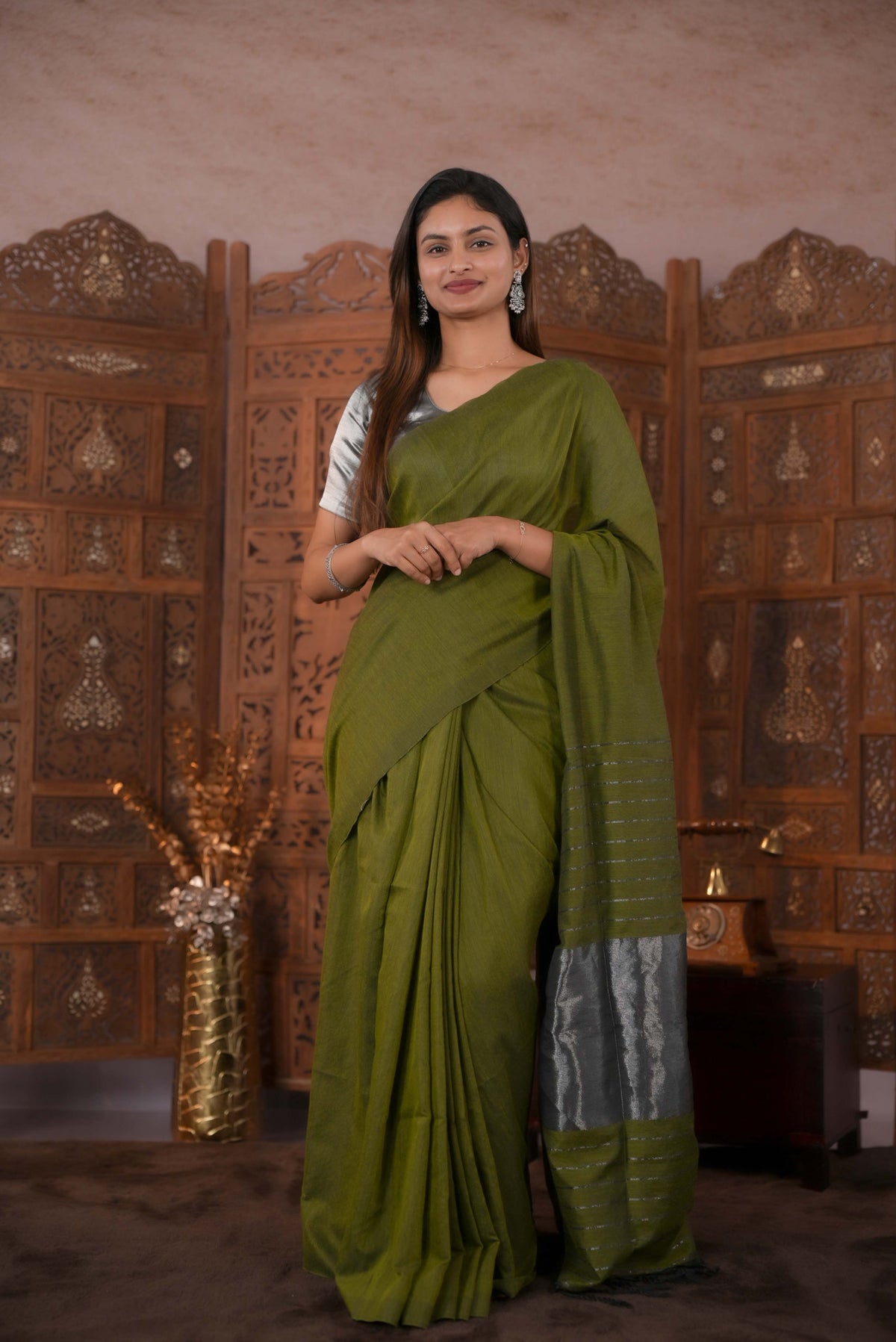 Olive Green Colour Soft Cotton Saree featuring a plain body, complemented by a striped pallu with tissue detailing, paired with a matching blouse piece.