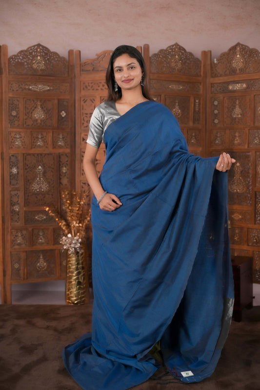 Peacock Blue  Colour Soft Cotton Saree featuring a plain body, complemented by a striped pallu with tissue detailing, paired with a matching blouse piece.
