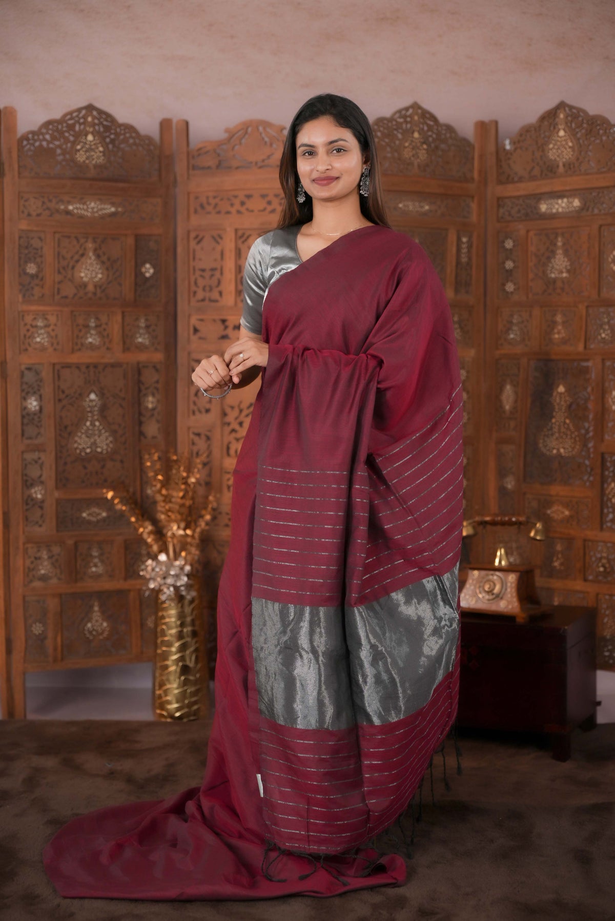 Maroon Colour Soft Cotton Saree featuring a plain body, complemented by a striped pallu with tissue detailing, paired with a matching blouse piece.