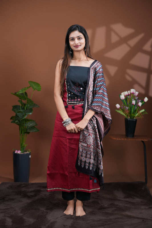 Maroon colour Jam Satin salwar material, Plain body with mirror & thread work on neck portion, matching bottom and Dupatta with ajrak print.